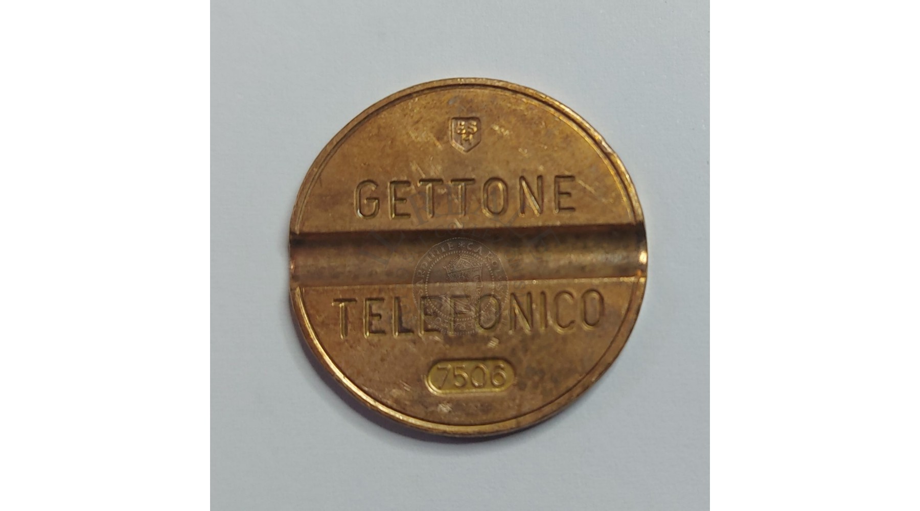 GETTONE TELEFONICO CON SEGNO DI ZECCA NUMERO DI SERIE 7506 RARO