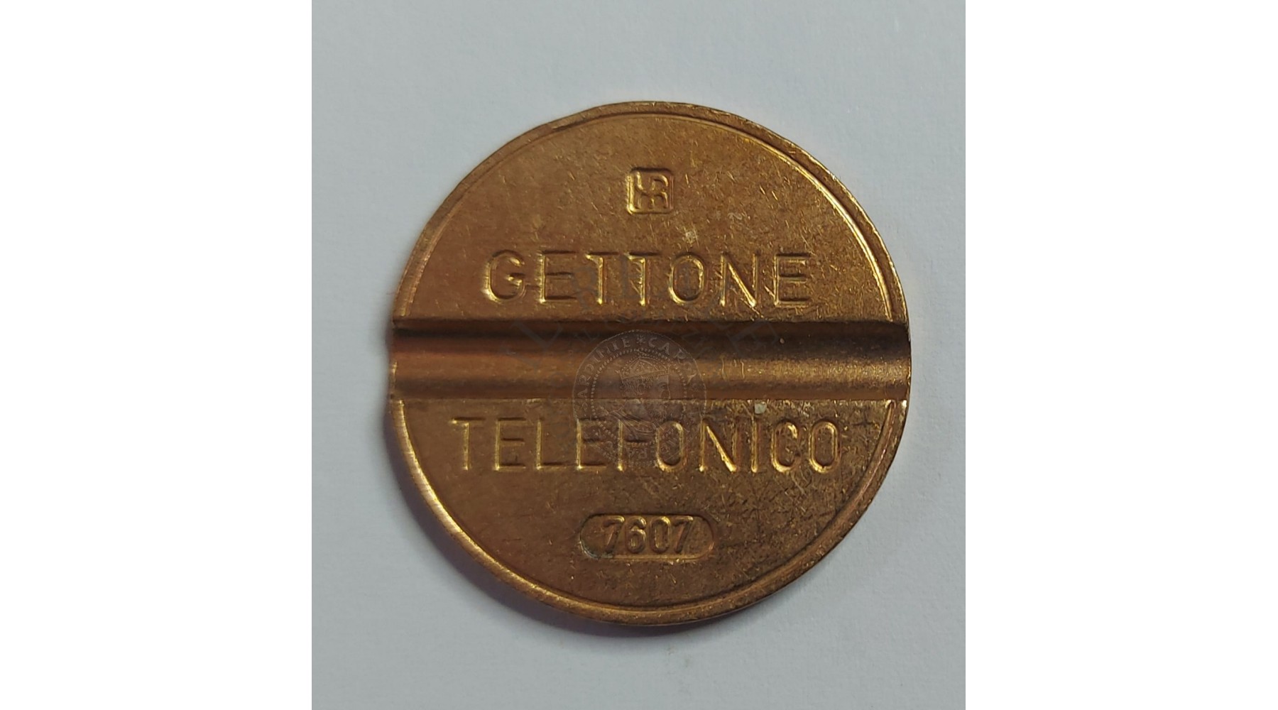 GETTONE TELEFONICO CON SEGNO DI ZECCA NUMERO DI SERIE 7607 RARO