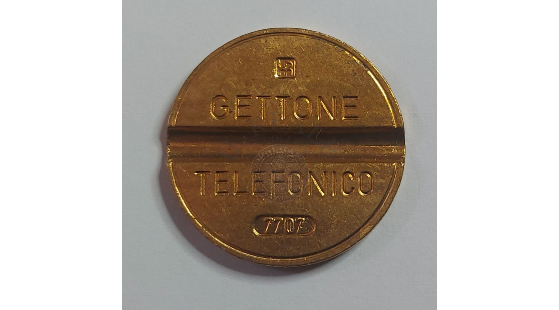 GETTONE TELEFONICO CON SEGNO DI ZECCA NUMERO DI SERIE 7707 RARO