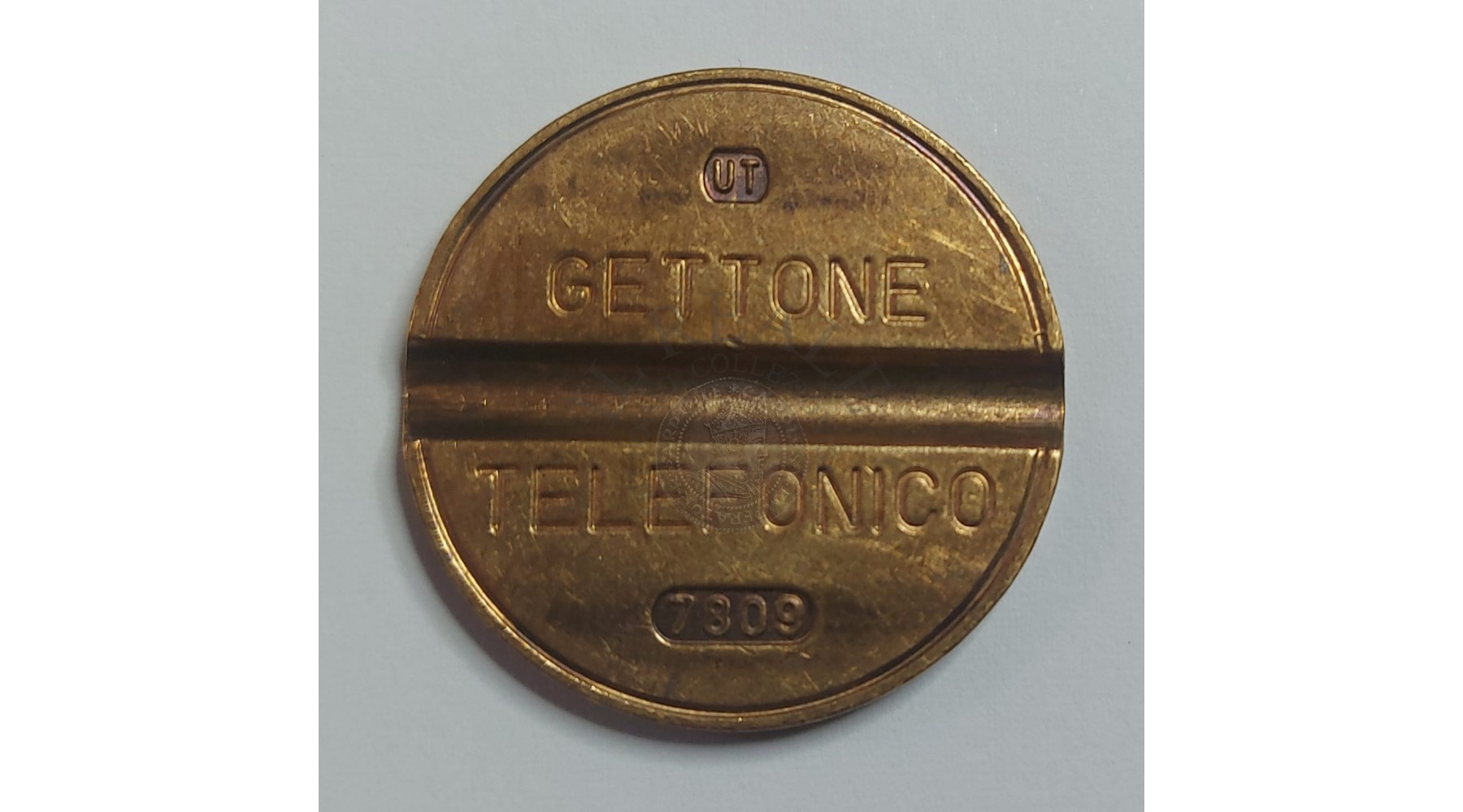 GETTONE TELEFONICO CON SEGNO DI ZECCA NUMERO DI SERIE 7809 RARO