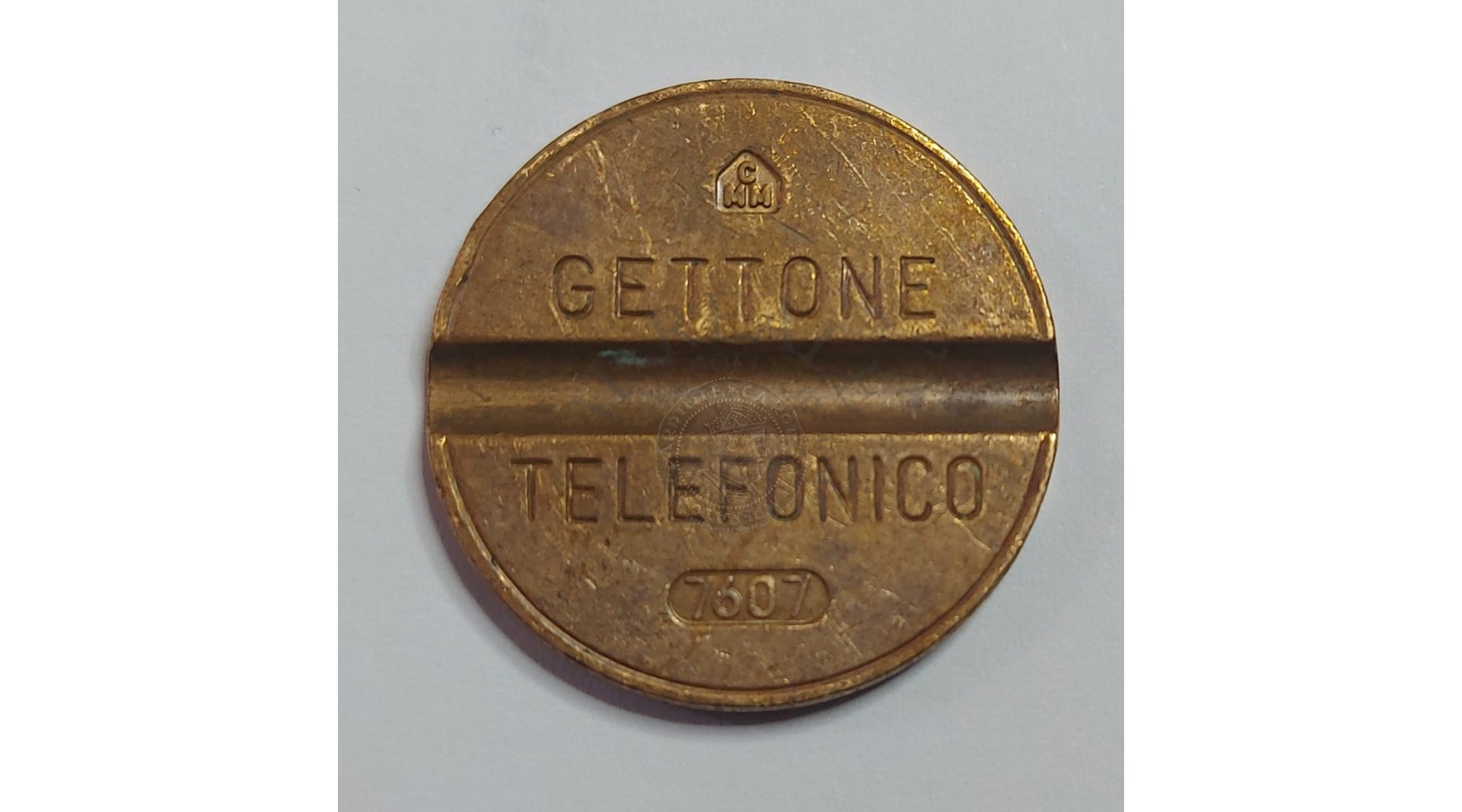 GETTONE TELEFONICO CON SEGNO DI ZECCA CMM NUMERO DI SERIE 7607 RARO