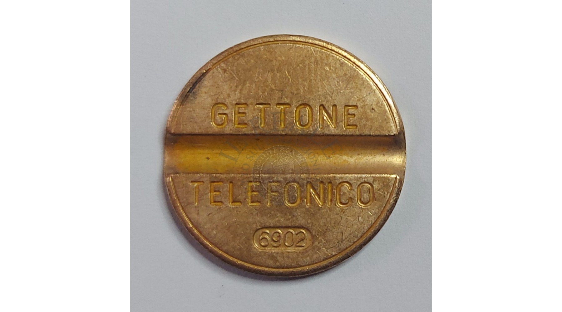 GETTONE TELEFONICO CON SEGNO DI ZECCA  NUMERO 6902