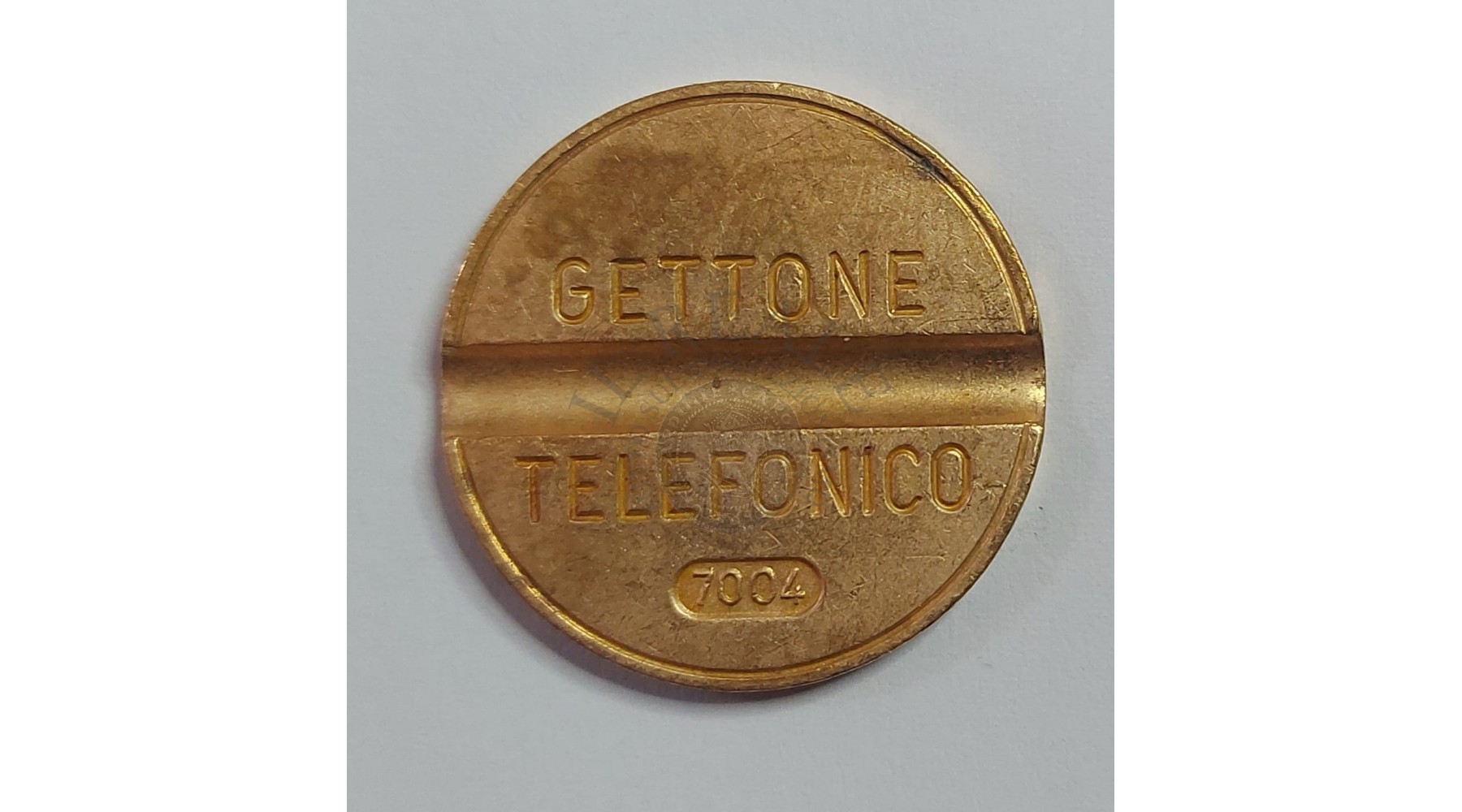 GETTONE TELEFONICO CON SEGNO DI ZECCA  NUMERO 7004