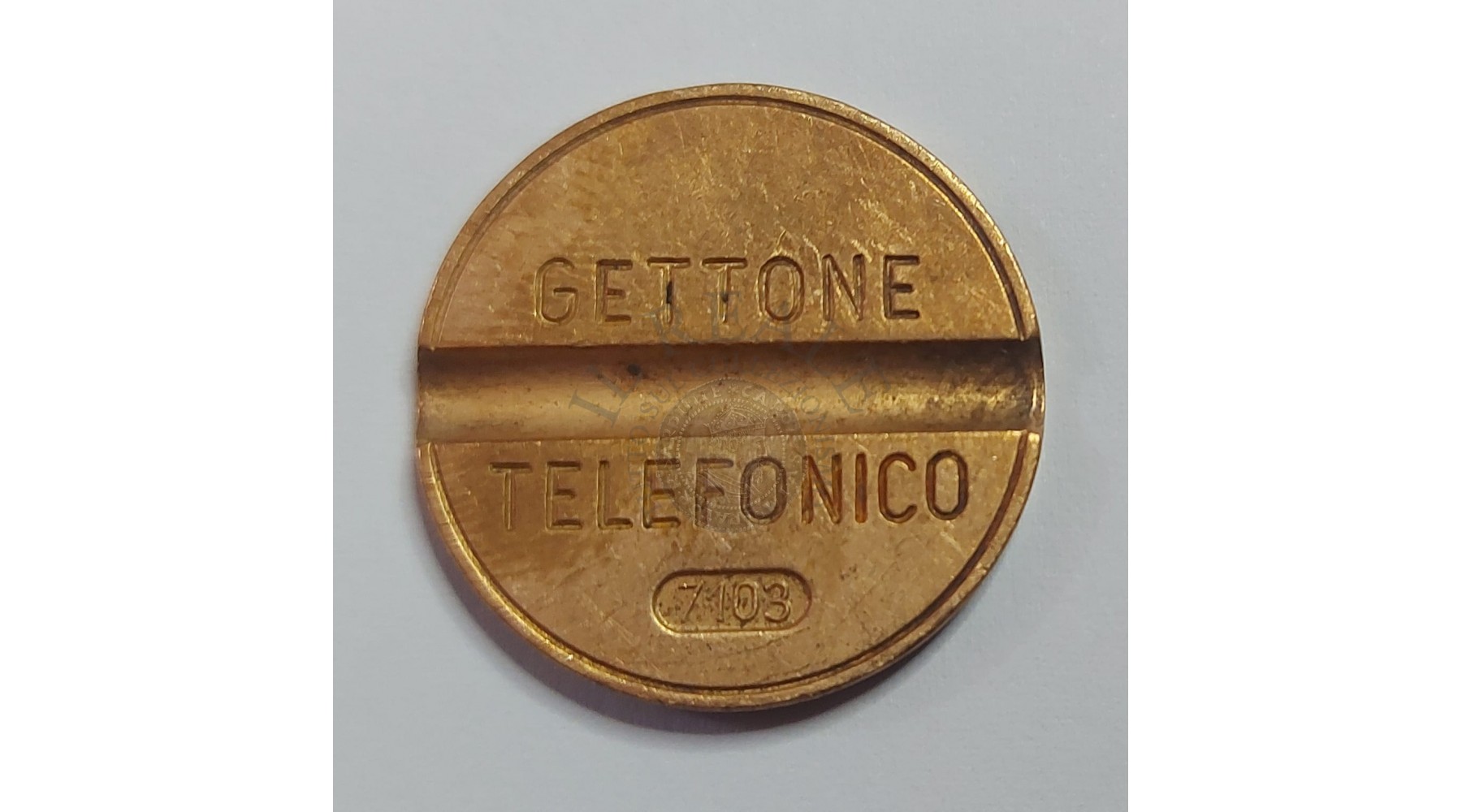 GETTONE TELEFONICO CON SEGNO DI ZECCA  NUMERO 7103