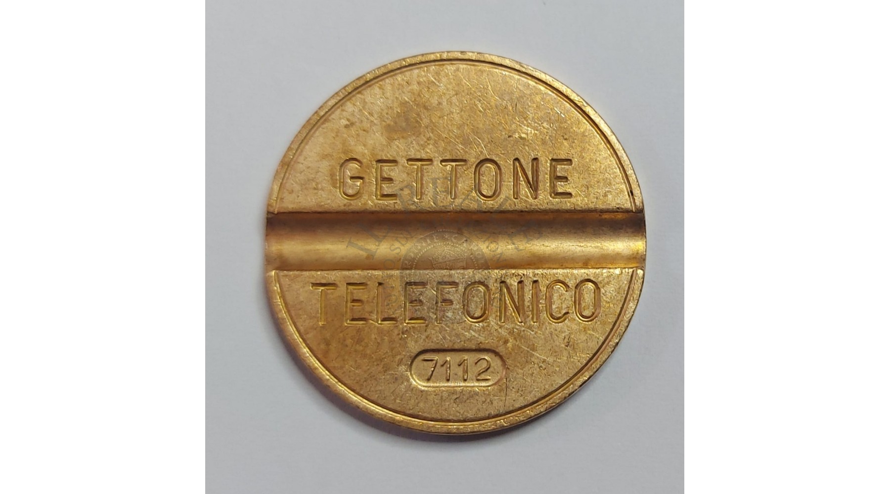 GETTONE TELEFONICO CON SEGNO DI ZECCA  NUMERO 7112